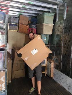 man carrying moving box