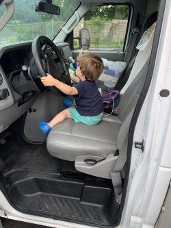 toddler in driver's seat