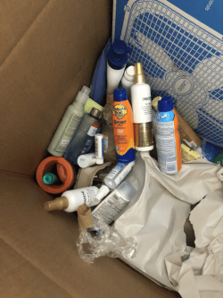 Miscellaneous toiletries tossed in a box