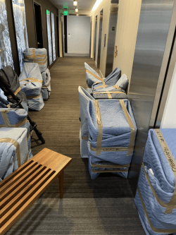 padded furniture ready for loading into an elevator