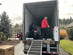 man loading a freight trailer