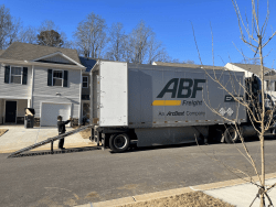 freight trailer parked outside a home