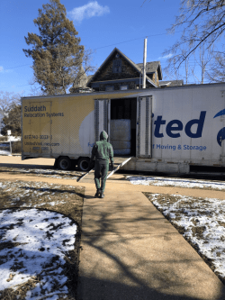 Mover walking towards a moving truck