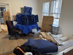 Office furniture packed into moving boxes