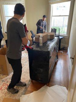 movers packing boxes for isabel's move