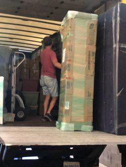 Bravo moving employee unloading a truck