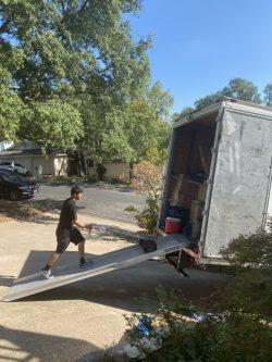 Mover walking up a moving truck loading ramp