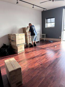 Man moving boxes into new home