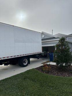 Bellhop Moving truck at a home