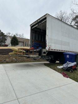 Bellhop moving truck delivering belongings